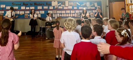 QEGS Sixth Form band 'Fluffy Socks' visits Huttoft Primary School